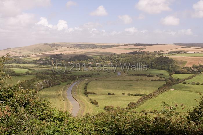downland valley.jpg - Clouds throwin a shadow over a river running through a valley in the South Down, East Sussex